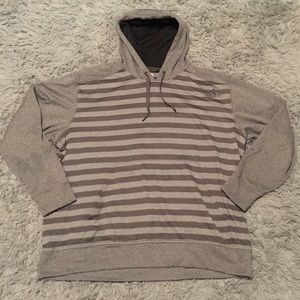Gray stripped Adidas hoodie.